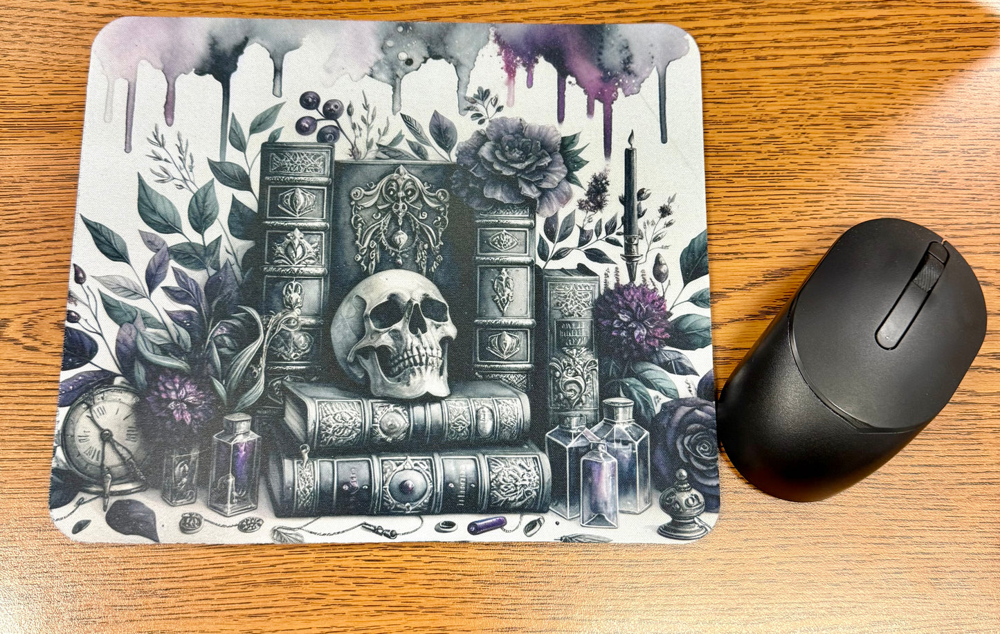 Skulls and books mousepad featuring a gothic dark academia design for book lovers, readers, writers, and home office decor.