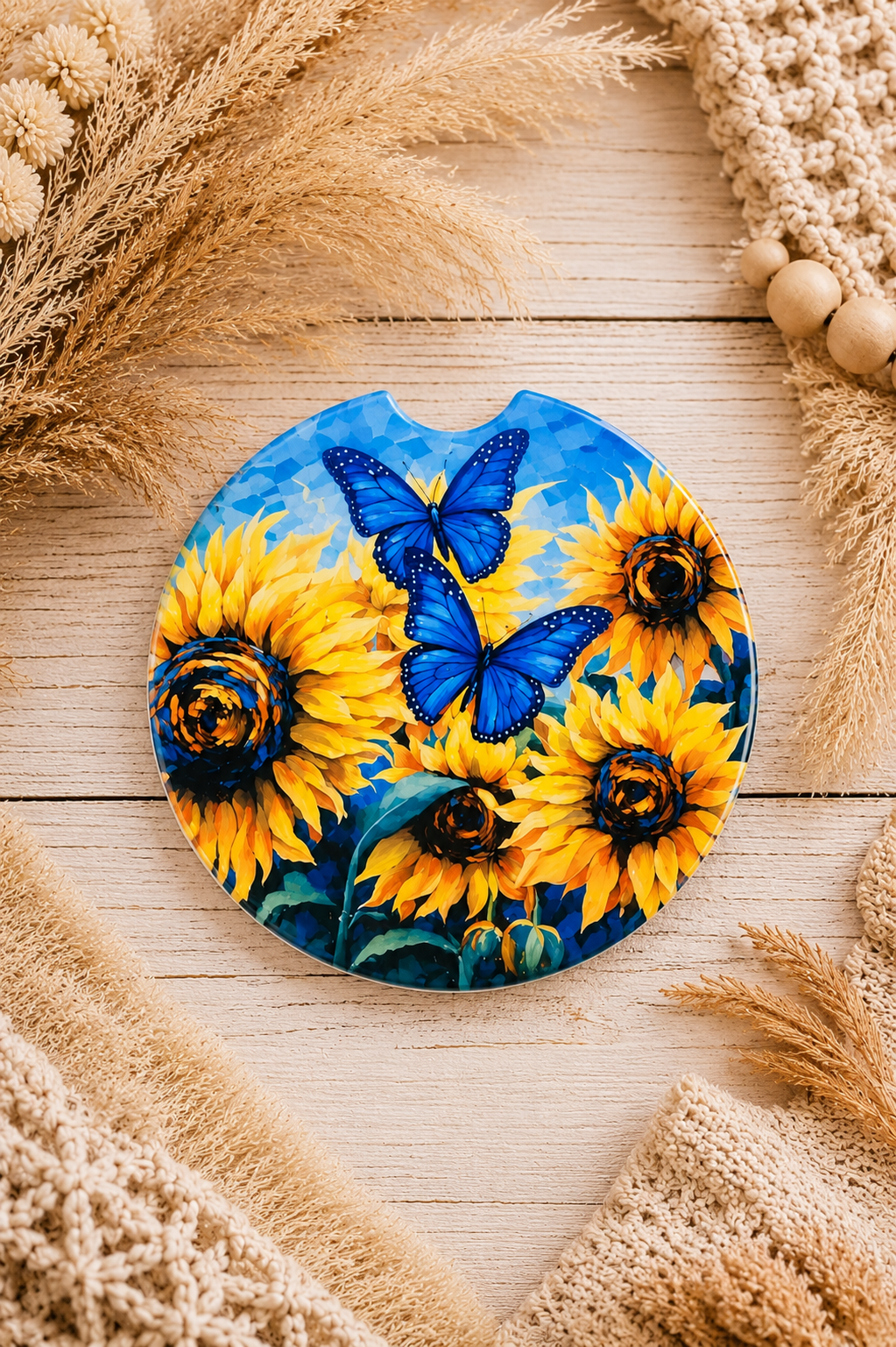 Sunflower and blue butterfly car coaster with vibrant yellow floral design by Chela Created.